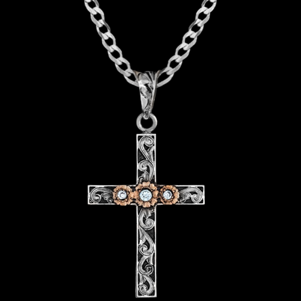 John, German Silver 1.6"x2.3" Cross with hand-engraved scrollwork and antique, copper flowers and Cubic Zirconia.

Chain not included.